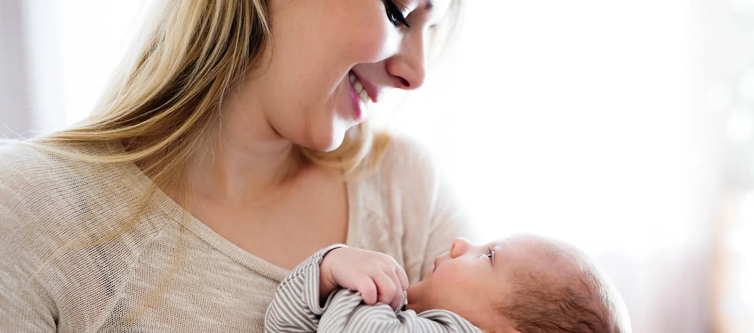 When do babies hold their head up?