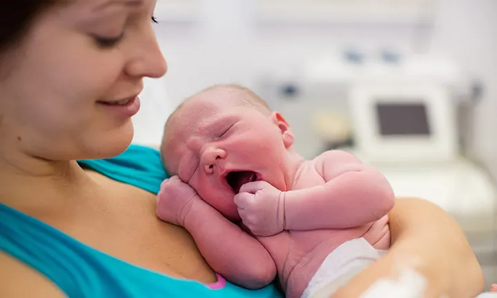 Mother Holding a Newborn Baby