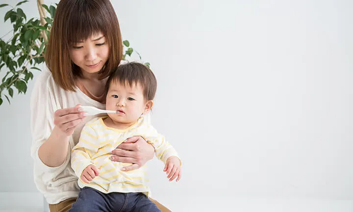 Mom checking baby temperature