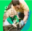 Sustainability- father and child planting
